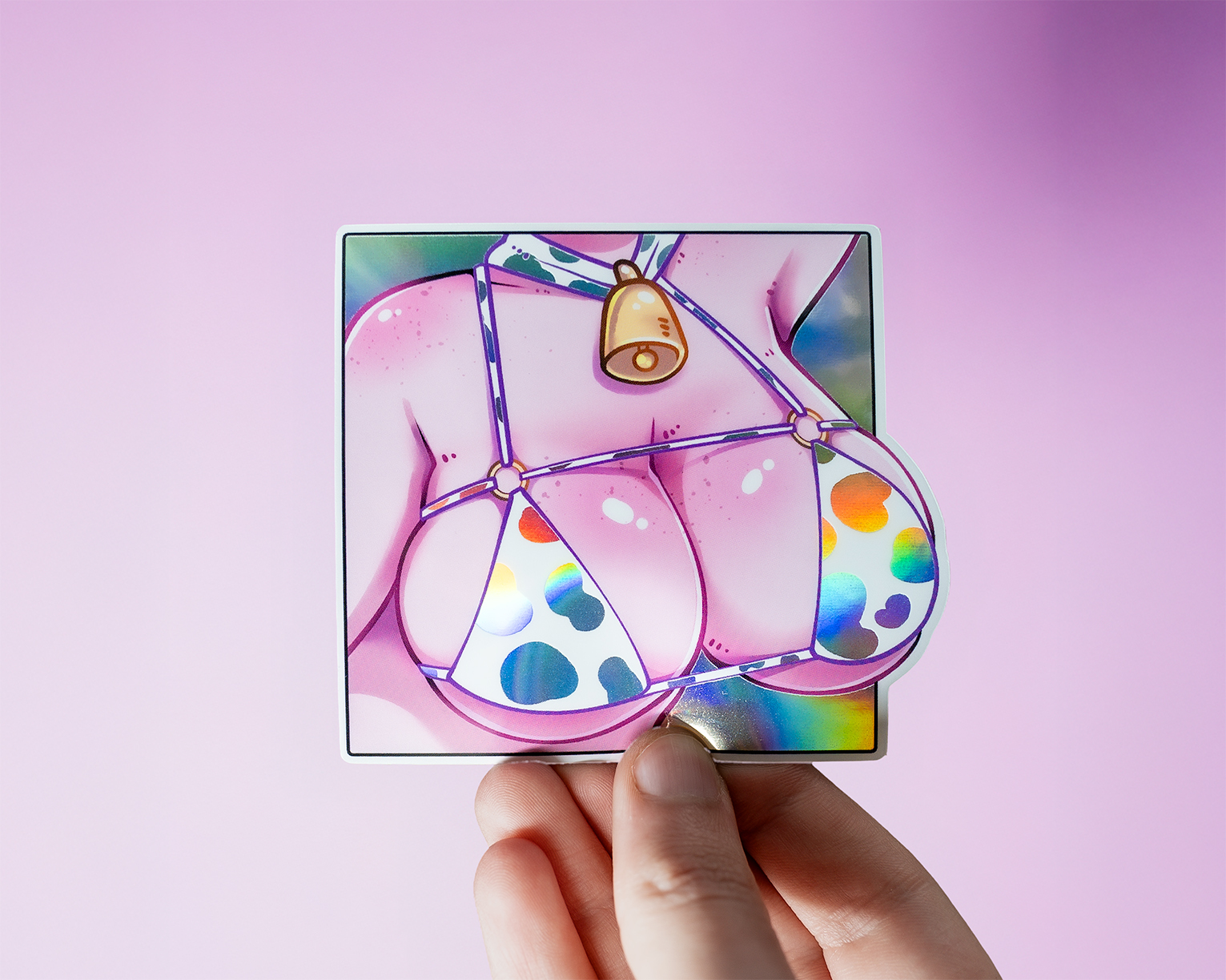 Close up of a pair of anime boobs wearing a cow print bikini