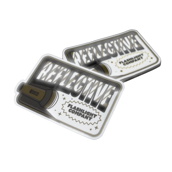 Pegatinas reflectantes con el dibujo de una linterna, texto en negrita y la etiqueta 'Flashlight Company'.